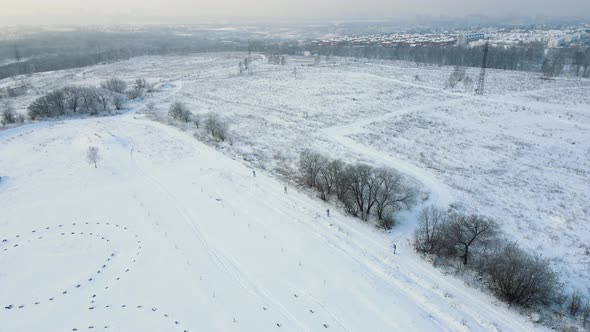 Four Soldiers in Winter Camouflage Are Skiing