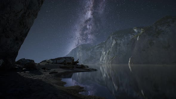 Hyperlapse of Night Starry Sky with Mountain and Ocean Beach in Lofoten Norway