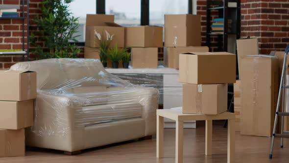 No People in Empty Living Room Apartment with Carton Boxes