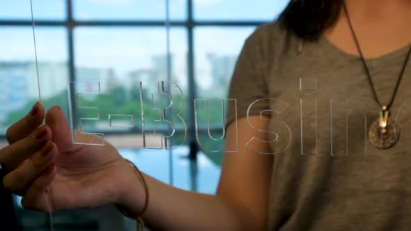 Woman Holding Glass E-Business Sign