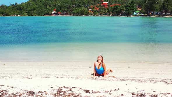 Ladies sunbathing on tropical sea view beach adventure by transparent water with white sand backgrou