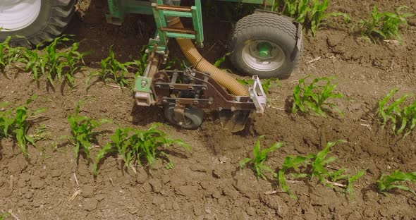 Tractor spreading fertilizer, Aerial closeup.