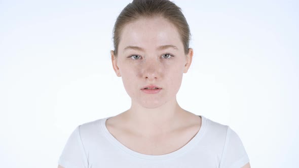 Portrait of Young Redhead Woman in Studio