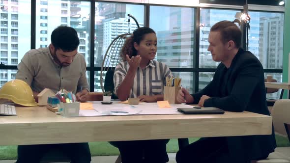 Creative Business People Group Having Conversation at Office Desk in Workplace