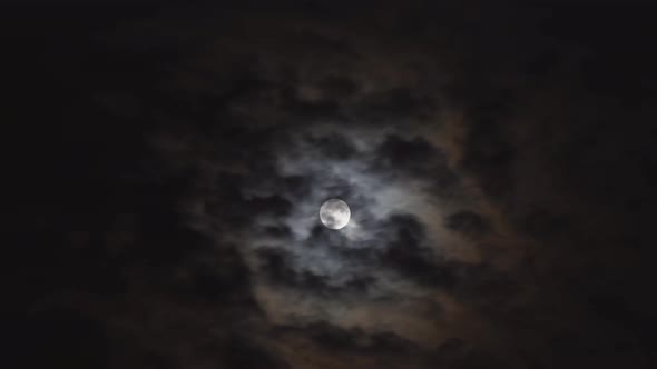 Mysterious night sky with full dramatic moon clouds in the moon light moon.