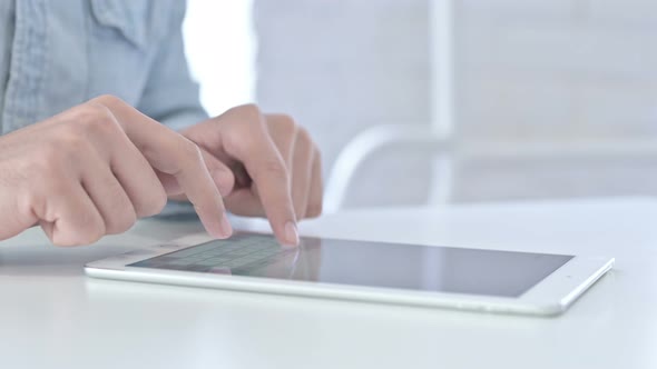 Close Up of Young Guy Hands Using Tablet