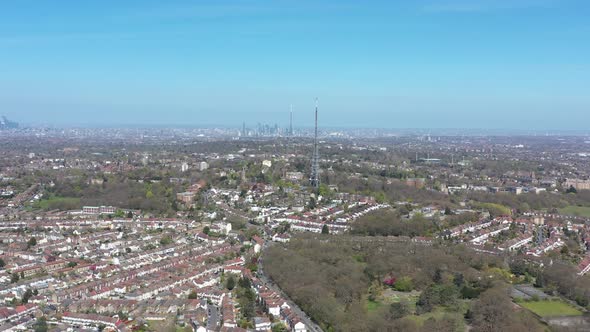 High dolly forward drone shot of two antenna in south London Crystal palace tower radio