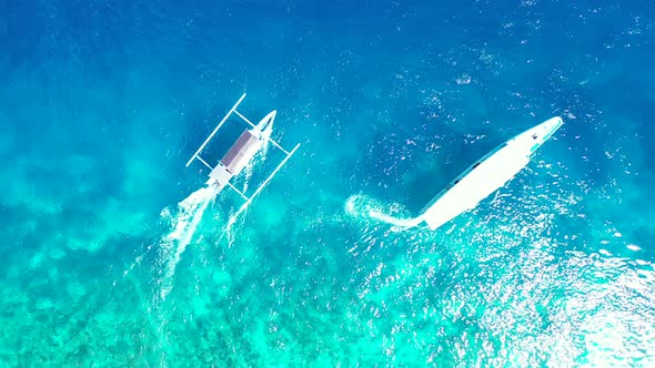 Wide aerial travel shot of a white sand paradise beach and turquoise sea background in best quality 