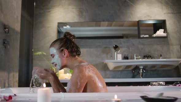 Caucasian woman taking bath in hotel