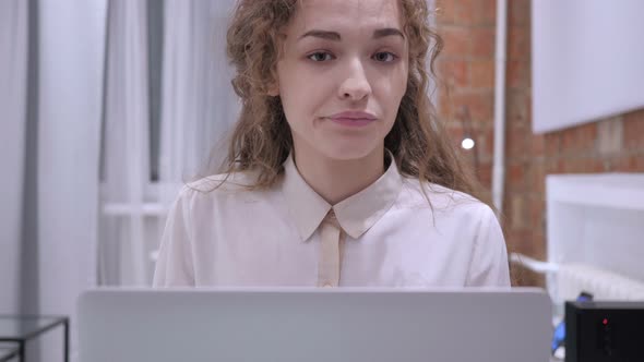 Shaking Head to No, Young Female Sitting on Chair at Home