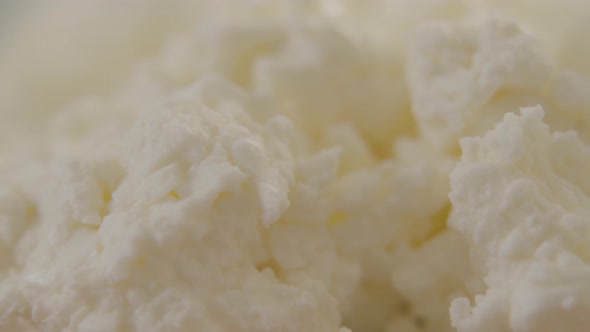 Extreme Close-up of Fresh White Cottage Cheese. Camera Moving From Left To Right Along Delicious