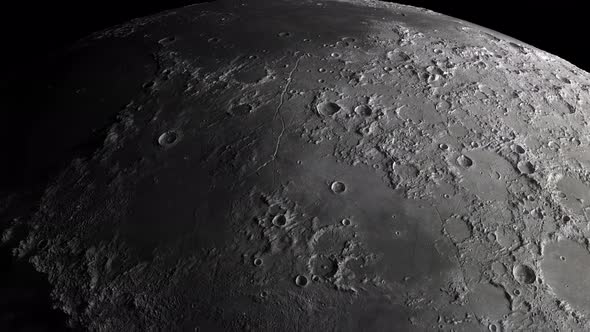 close-up of the moon. flight of the camera along the surface of the moon dotted with craters alt