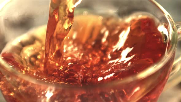 Super Slow Motion Tea Pours Into the Cup Whirlpool