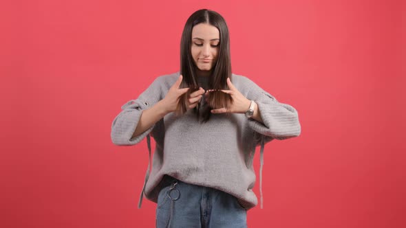 Sad Young Woman Touching Damaged Hair, Worrying About Hair Loss.