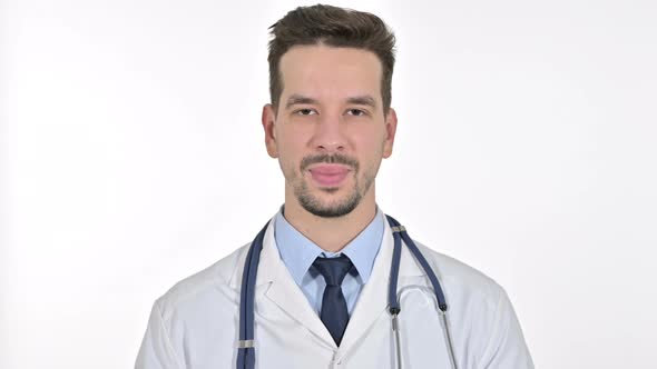 Portrait of Smiling Young Male Doctor Looking at the Camera , White Background