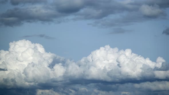 Fluffy cloud time lapse on a cloudy day 4k footage.