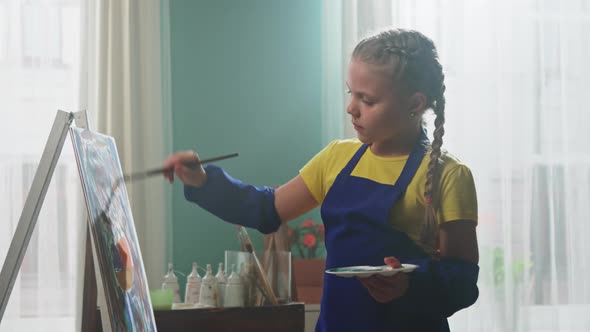 Little Girl Artist Is Looking On Camera