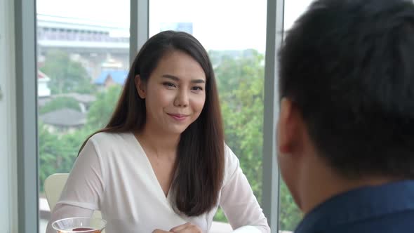 Happy Romantic Couple Eating Lunch at Restaurant