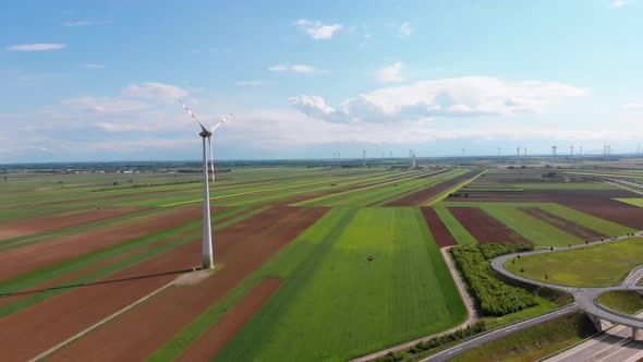 Aerial View of Wind Turbines Farm and Agricultural Fields. Austria