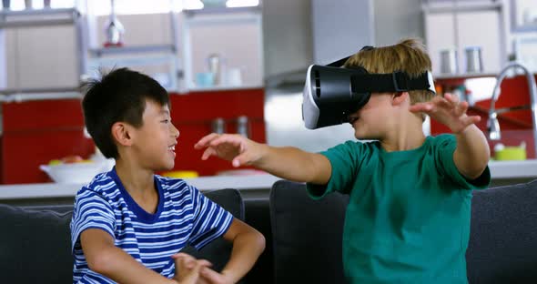 Siblings using virtual reality headset