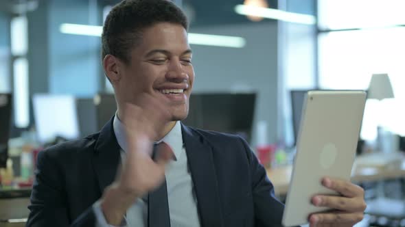 Portrait of African Businessman Doing Video Chat on Tablet