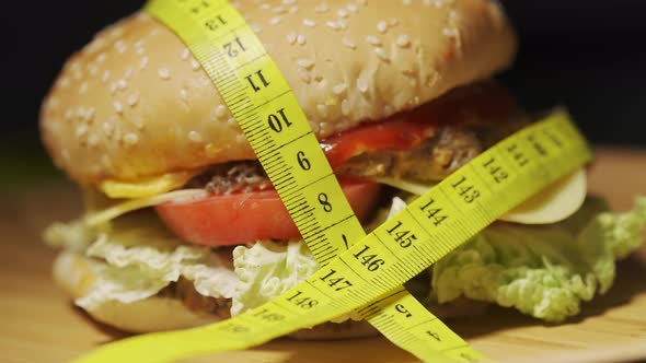 A Burger Wrapped in a Measuring Tape