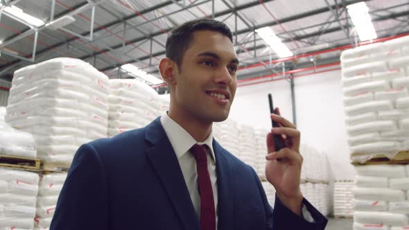 Young female male worker in a warehouse