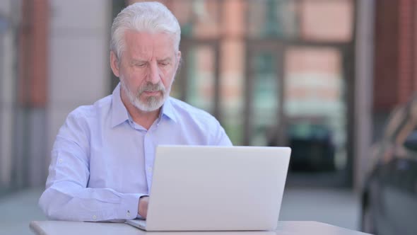 Outdoor Cheerful Old Man Smiling at Camera