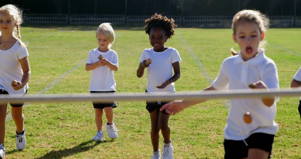 Children playing lemon and spoon race