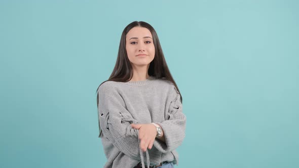 Puzzled Young Woman Expressing Doubting, Hesitating Emotion