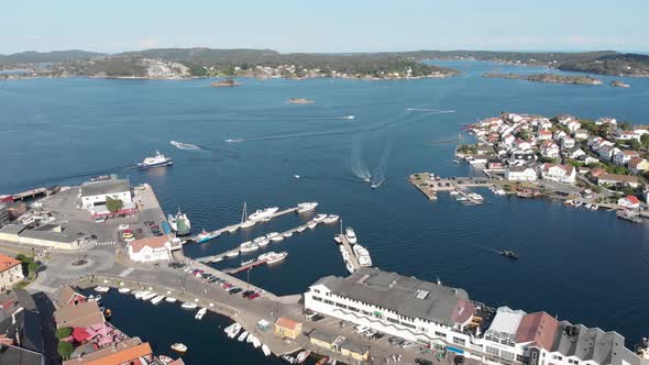 Drone view - boating traffic and local ferry at marina of Kragero, Norway