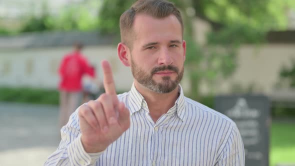 Outdoor Portrait of No Sign By Middle Aged Man By Finger Shake