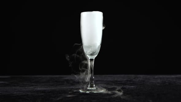 Drink in Glass of Champagne with the Effect of Dry Ice