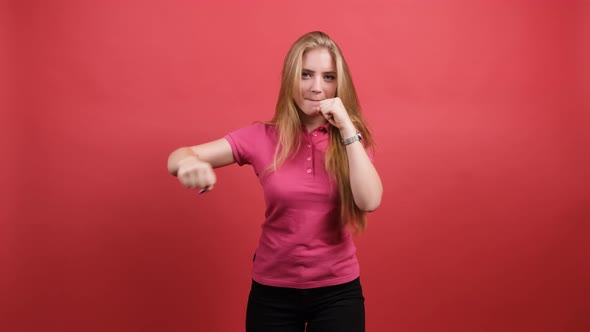 Young Beautiful Girl Fight with Fist Defense Gesture, Angry and Upset Face.