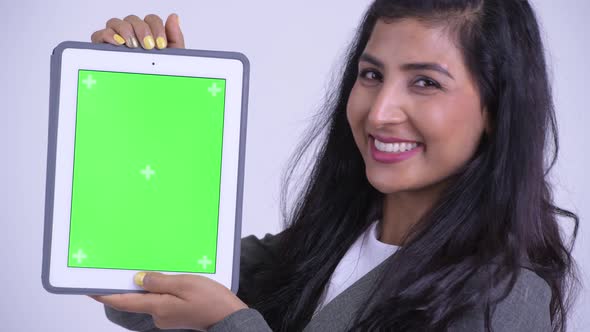 Face of Young Happy Persian Businesswoman Showing Digital Tablet