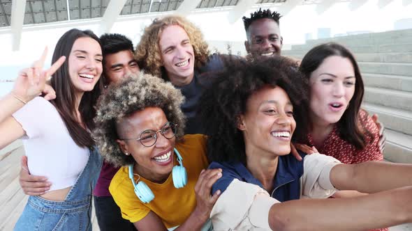 Group of Happy Multiracial People Taking a Selfie with Mobile Phone