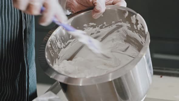 Woman Chef Making a Cake  Mixing the Top White Cream for Cake