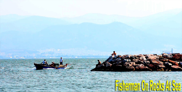 Fisherman On The Rocks 