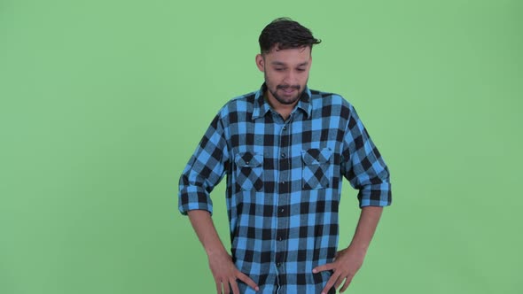 Stressed Young Bearded Persian Hipster Man Looking Around and Feeling Upset