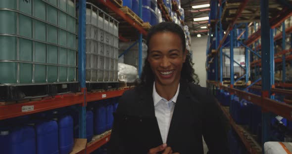 Portrait of young female manager in a warehouse