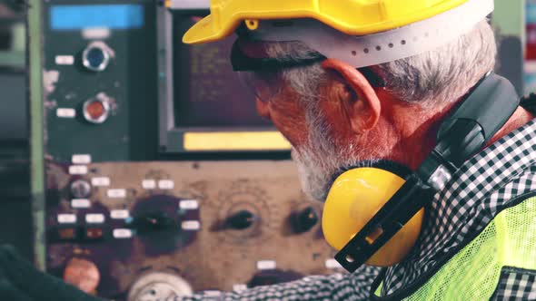 Senior Factory Worker Teach How to Use Machine Equipment in the Factory Workshop