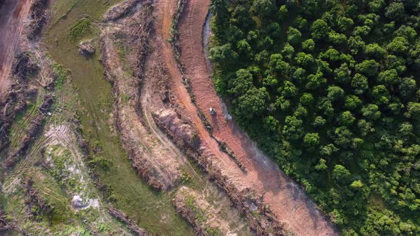 Aerial view following excavator move at land clearing area