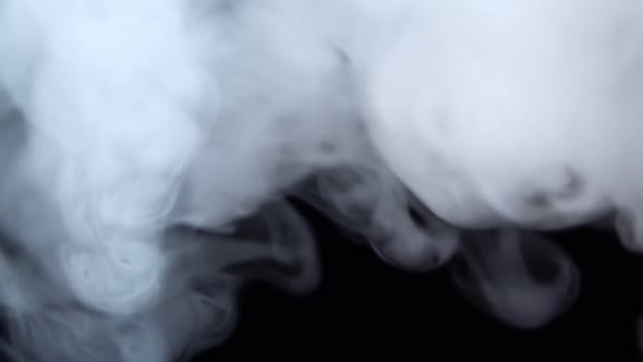 White Smoke Floating Through Space Against Black Background. Mist, Smoke , Vapor, Fog Effect. Slow