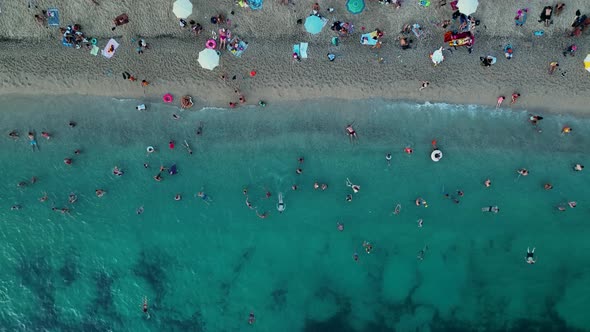 People swim in the evening sea aerial view 4 K Turkey Alanya