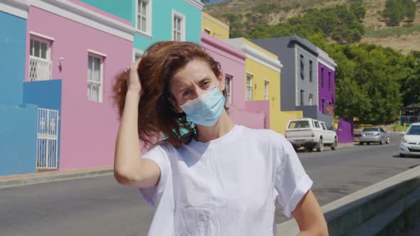 Woman Masked During Quarantine in the Streets of Colorful Buildings Neighbourhood BoKaap Cape Town