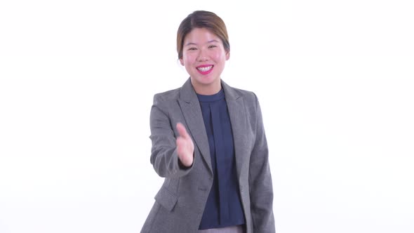 Happy Young Asian Businesswoman Giving Handshake