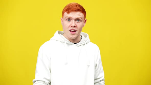 Portrait of Excited Man Looking at Camera with Surprised Facial Expression