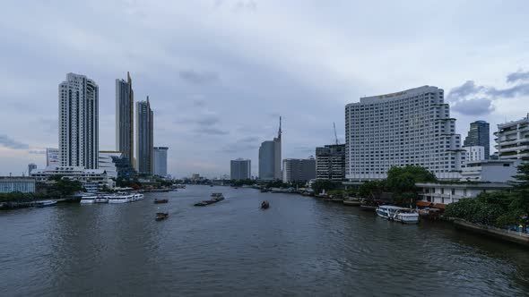 Time lapse of boats with Taksin Bridge and Chao Phraya River, Bangkok Downtown. Thailand.