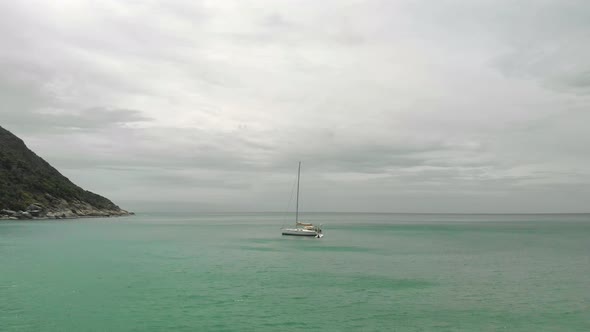 A wide shot of a boat in the bay of Ko Pha-ngan District Surat Thani Thailand Asia