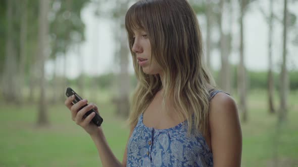 Woman making phone call using mobile phone